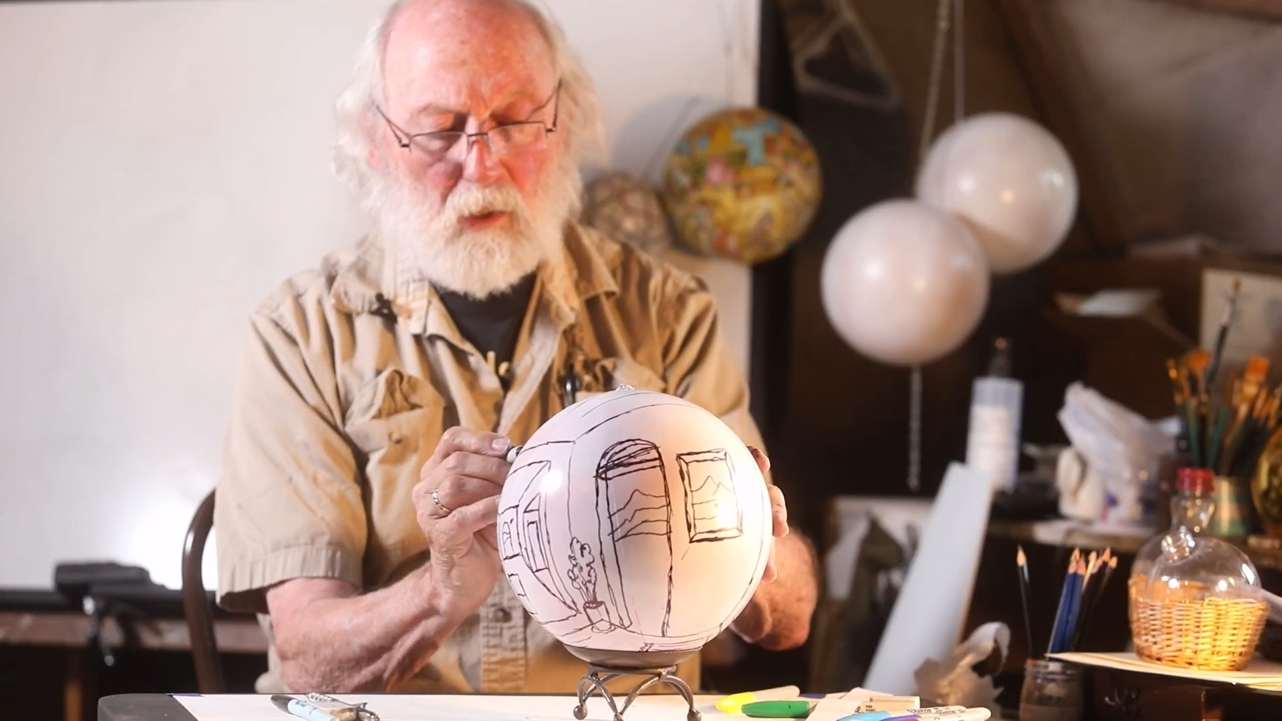 Artist and BHSU Alumnus Dick Termes works on one of his famous Termespheres